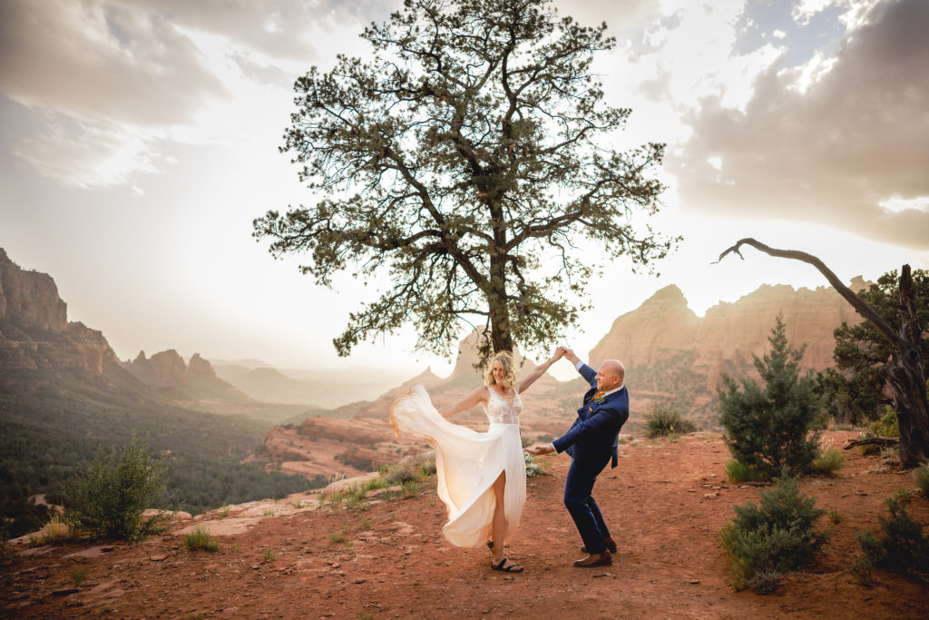 Aimee & Justin's Real Wedding at Lovers Knoll and Merry GO Round Sedona, Arizona - Bride and Groom Celebrate and Dance