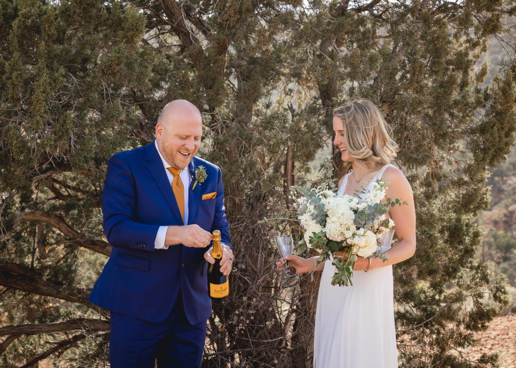 Aimee & Justin's Real Wedding at Lovers Knoll and Merry GO Round Sedona, Arizona - Champagne Time