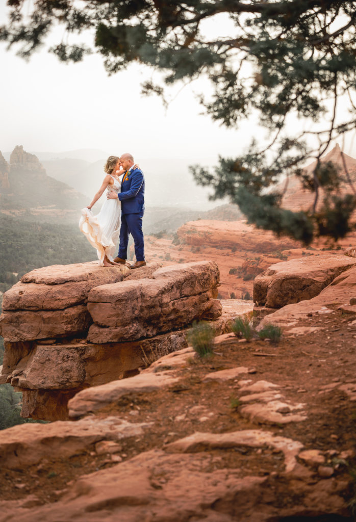 Aimee & Justin's Real Wedding at Lovers Knoll and Merry GO Round Sedona, Arizona - Forehead to forehead pose