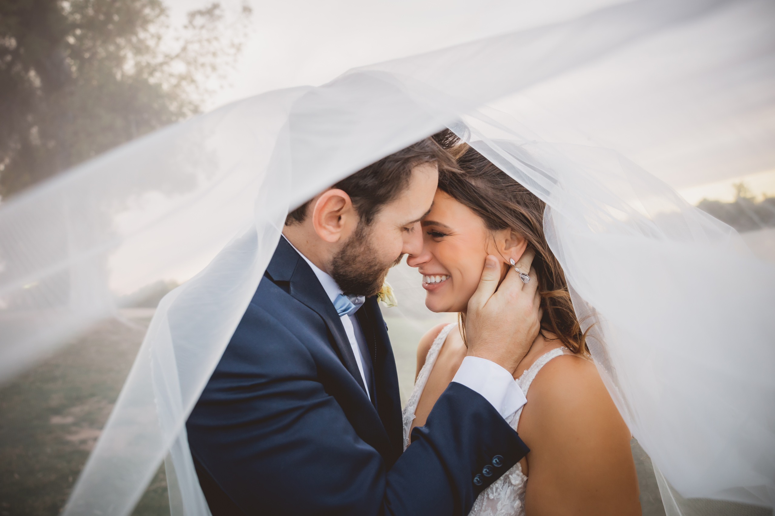 Bride and Groom sharing a moment under the veil captured by AZ Wedding Photographer